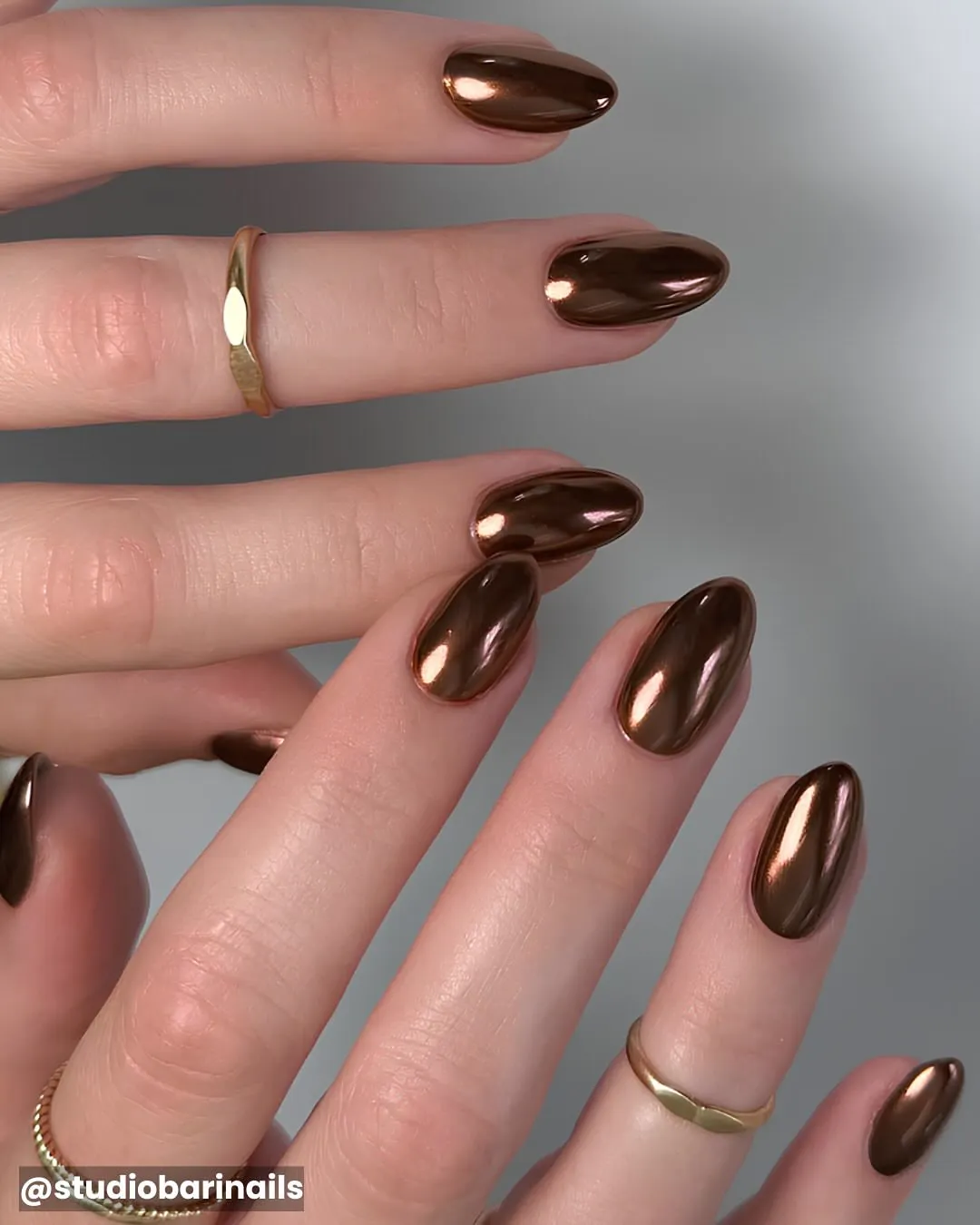 Solid reflective brown metallic almond nails