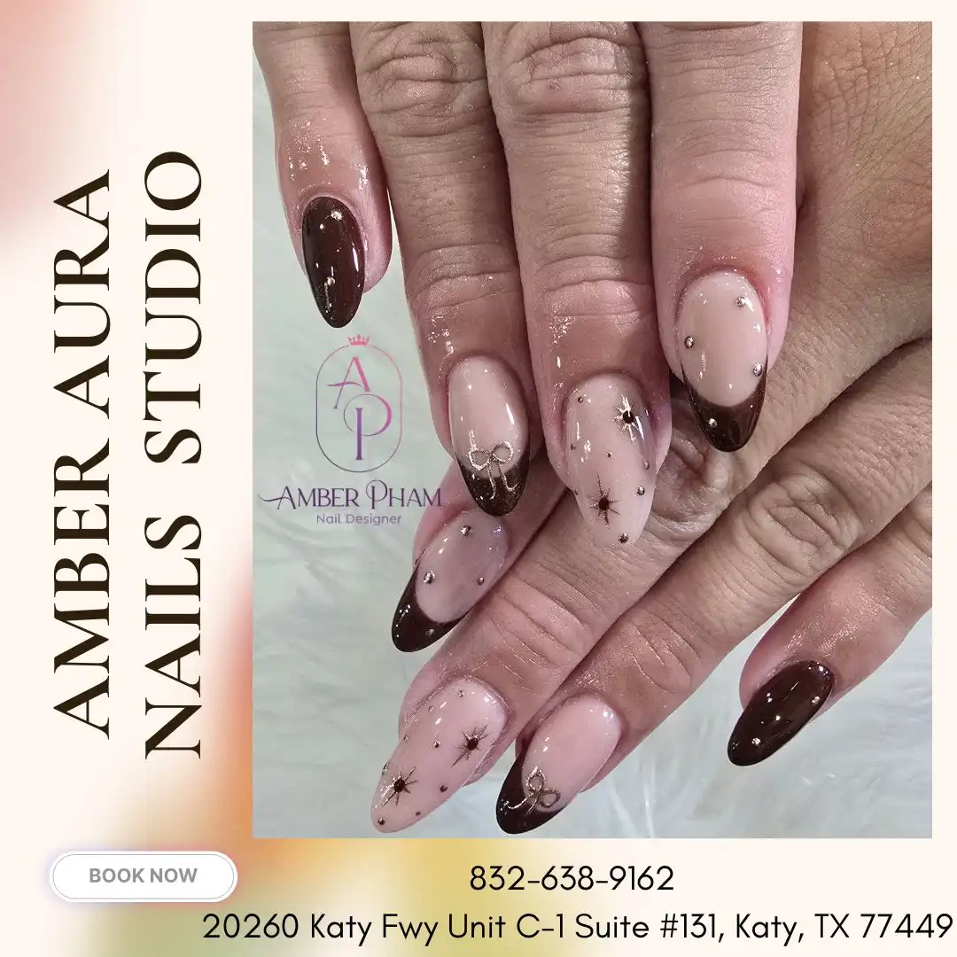 Dark brown French tips with starburst details and studs