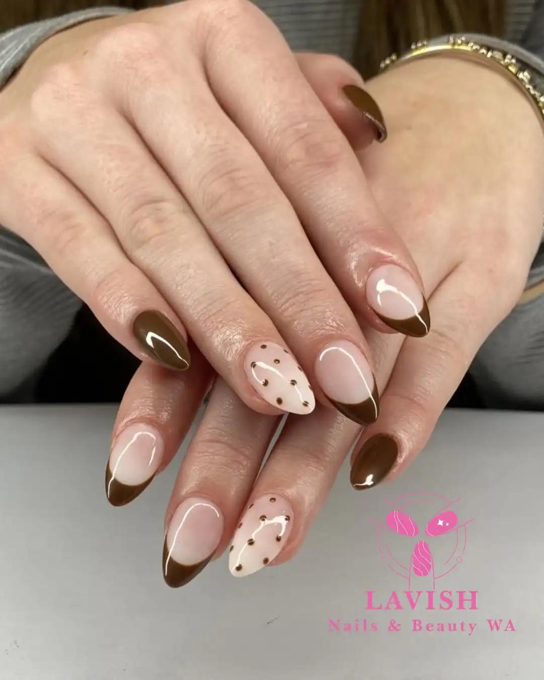 Classic brown French tips with scattered dot accents