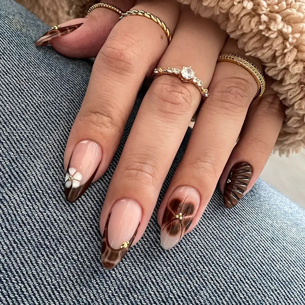 Brown French tips with floral art and small gold beads