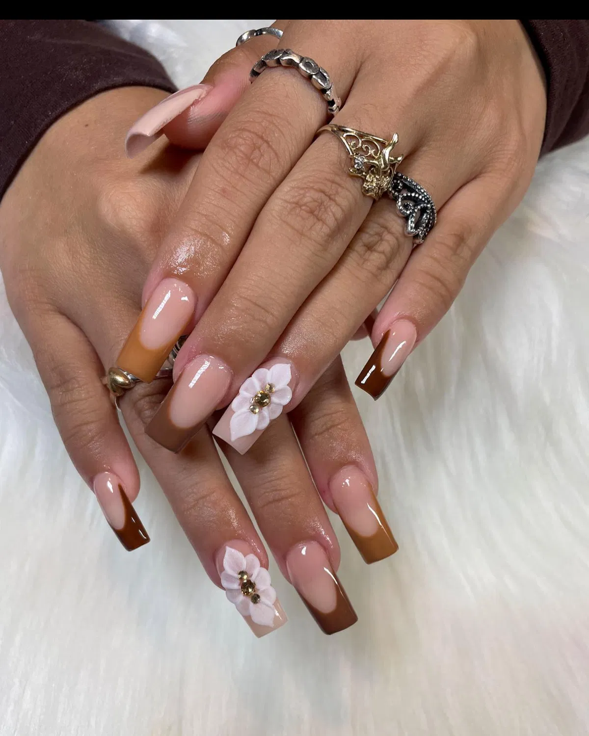 Two-tone brown French tips with white 3D flowers
