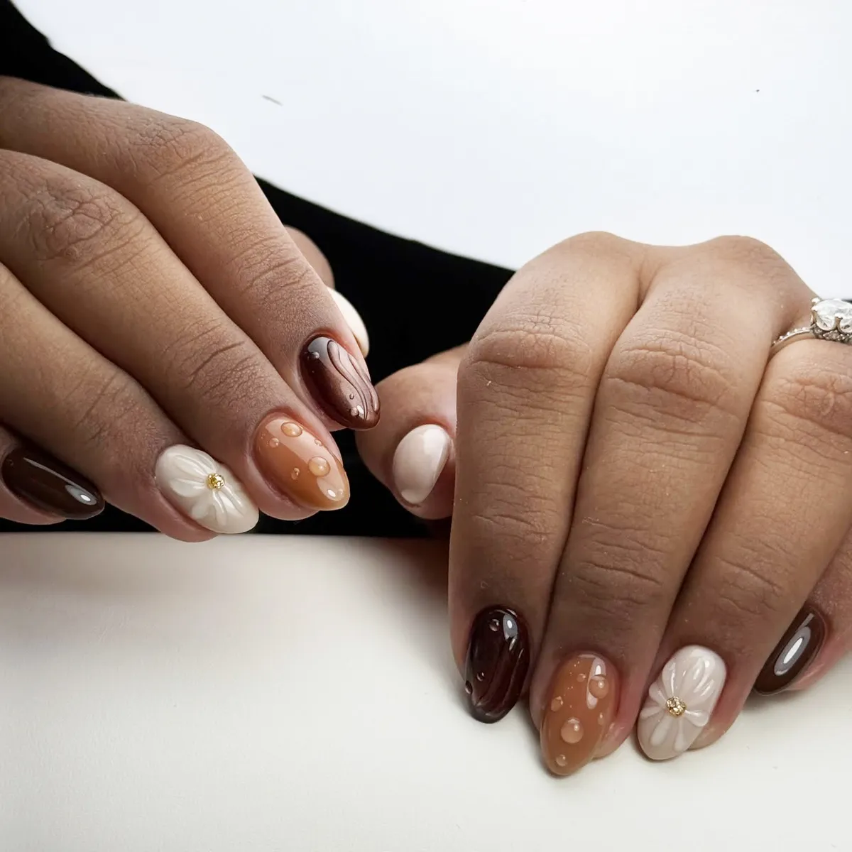 Short glossy browns with 3D white flower and raised droplets