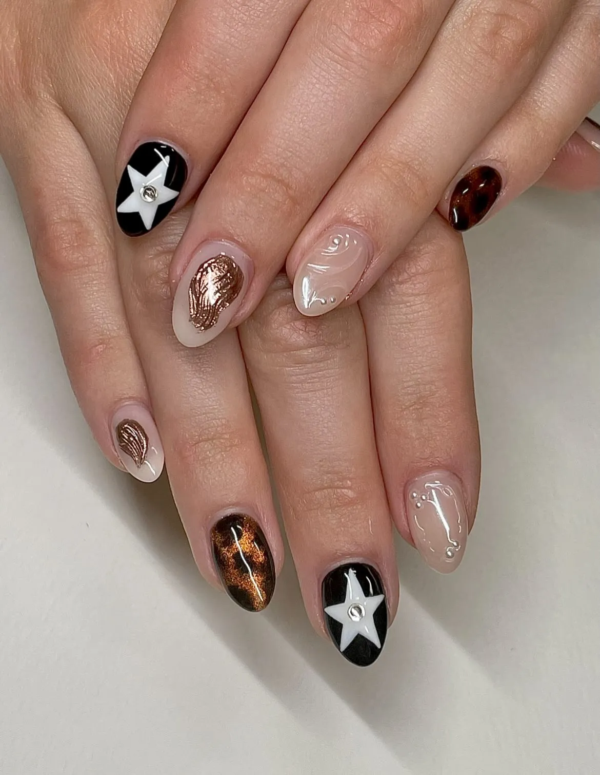 Black star accents with brown metallic and clear raised swirls