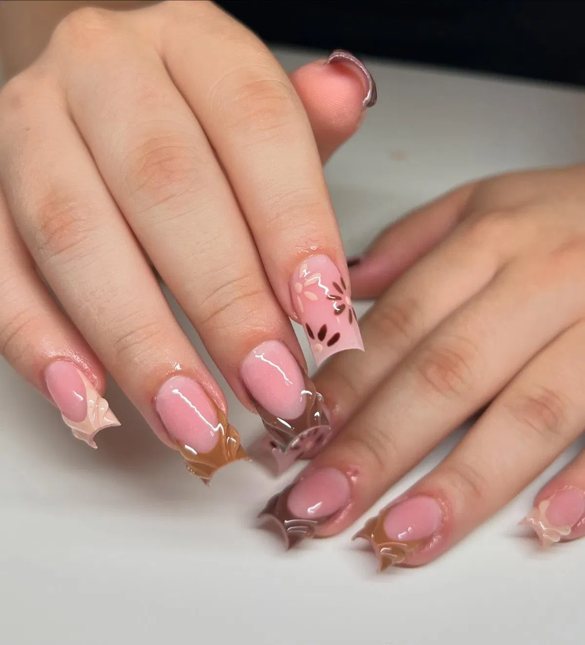 Pink-and-brown swirl set with petal-like accents