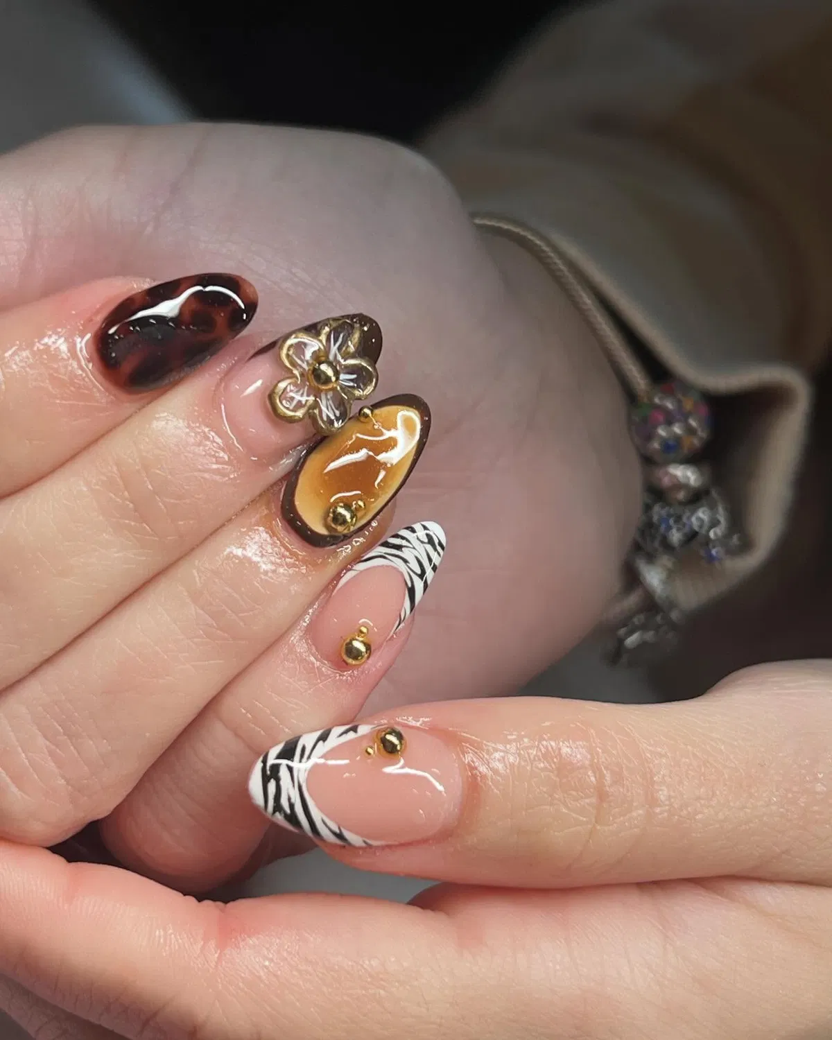 Brown and zebra French tips with gold studs