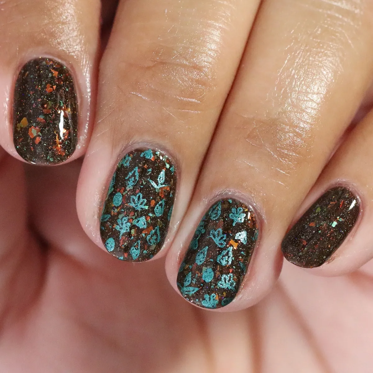 Dark brown glitter with teal floral overlay
