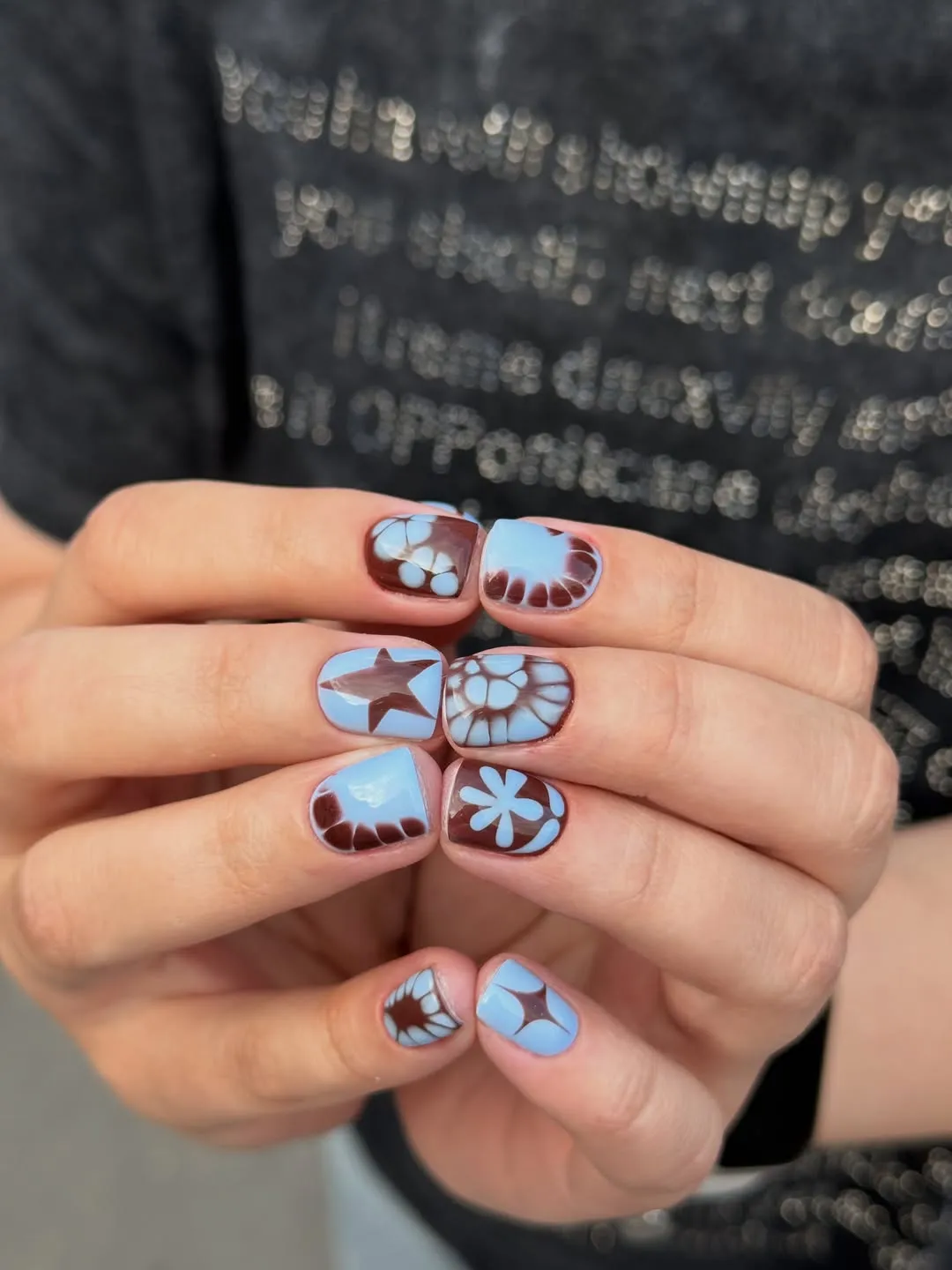 Light blue and brown graphic stars and florals