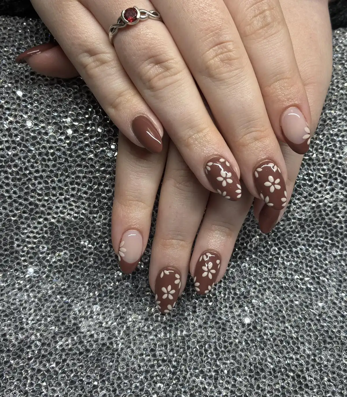 Brown floral nails with nude-and-brown French accents