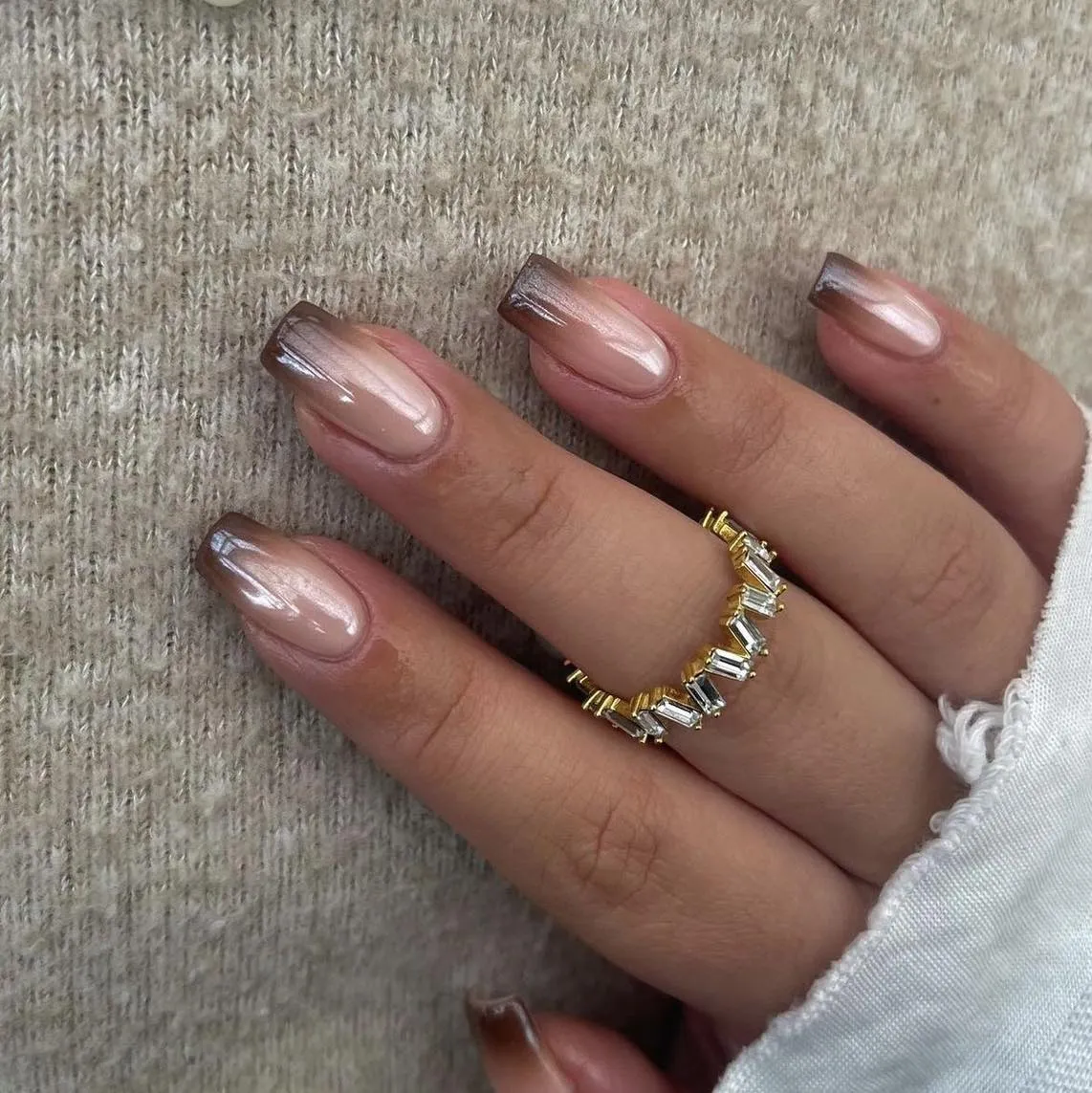Nude pink nails with brown gradient tips