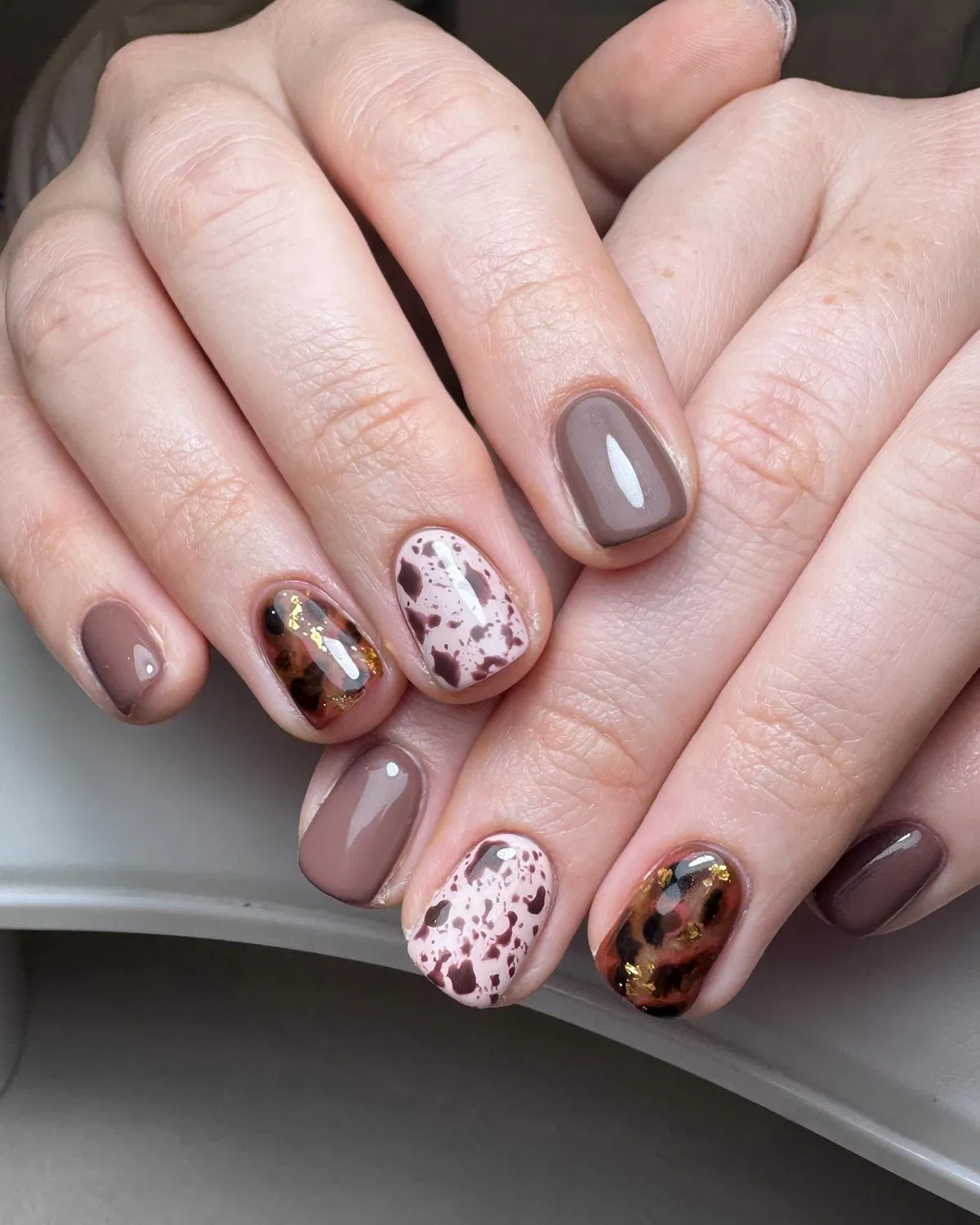 Taupe-brown with speckles and gold-fleck accents