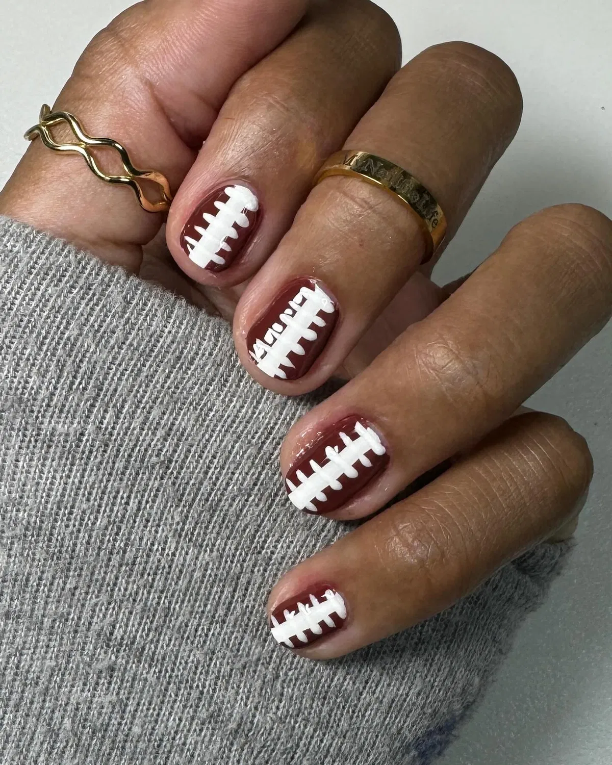 Minimal brown nails with white football laces
