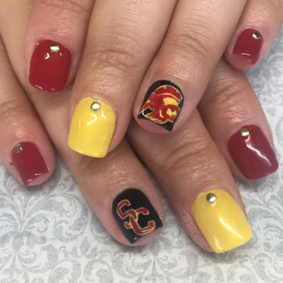 Maroon and yellow with black logo accents and studs