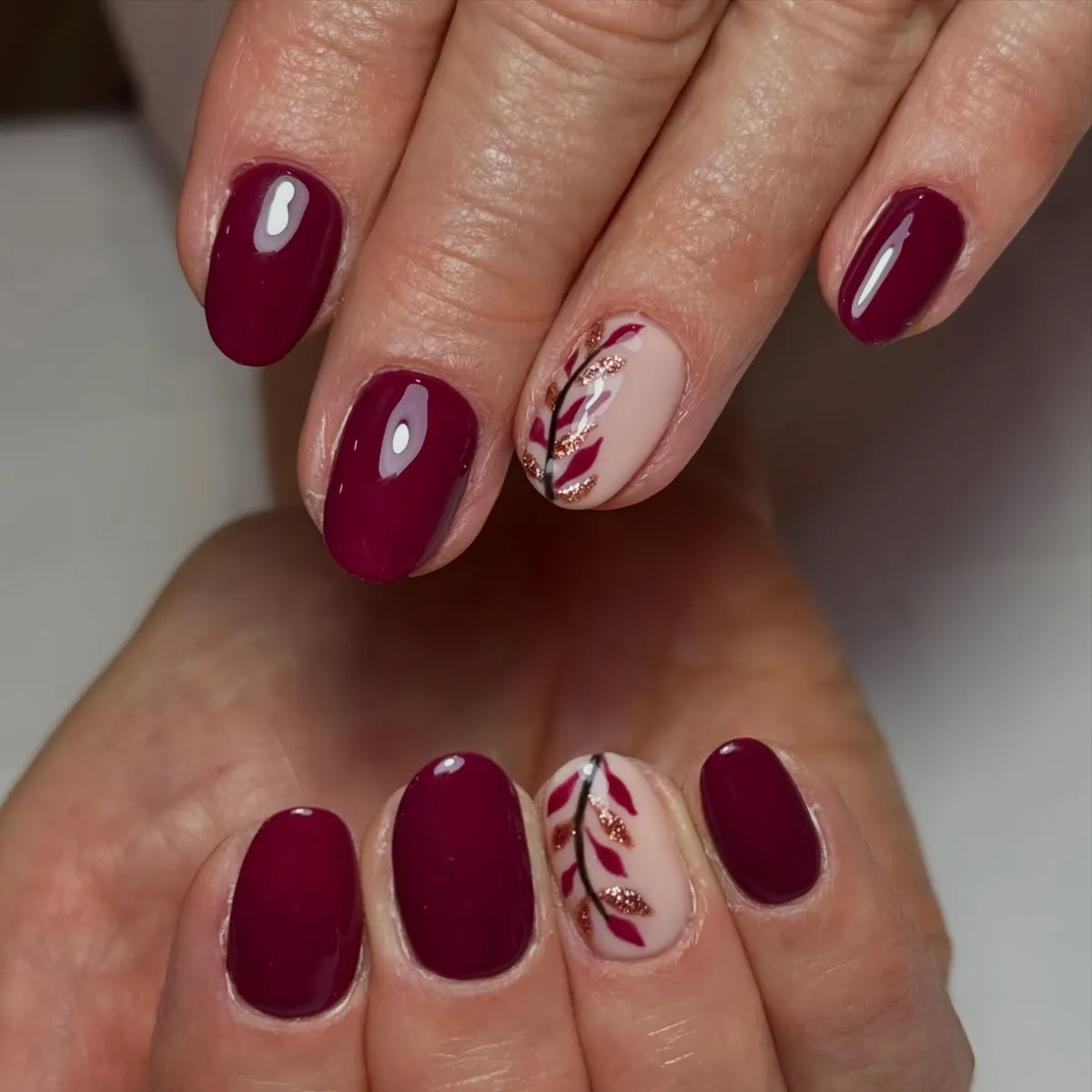 Deep plum with nude branch-and-leaf accents