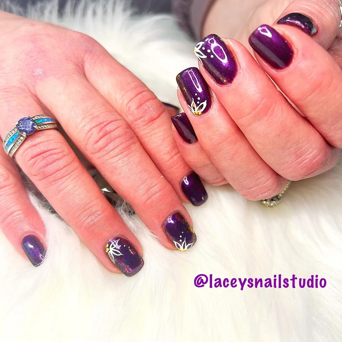 Glossy plum with white line art and gold accents
