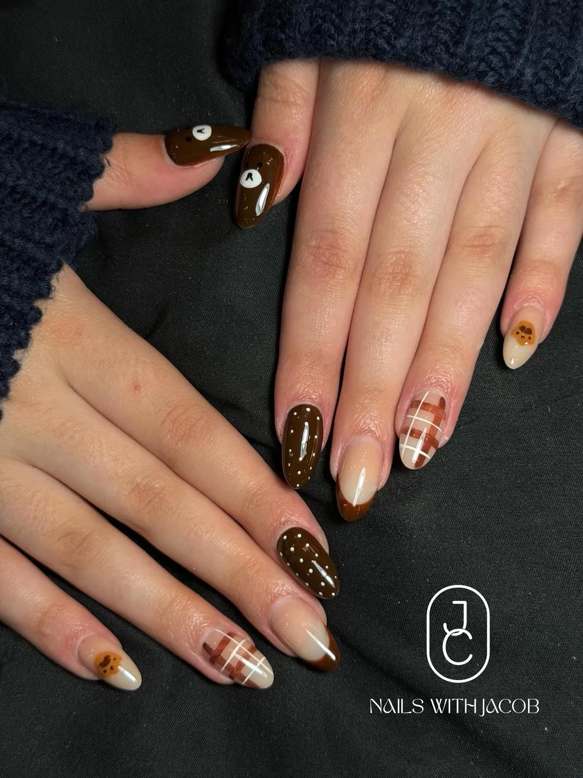 Brown dotted nails with plaid and bear-face accents