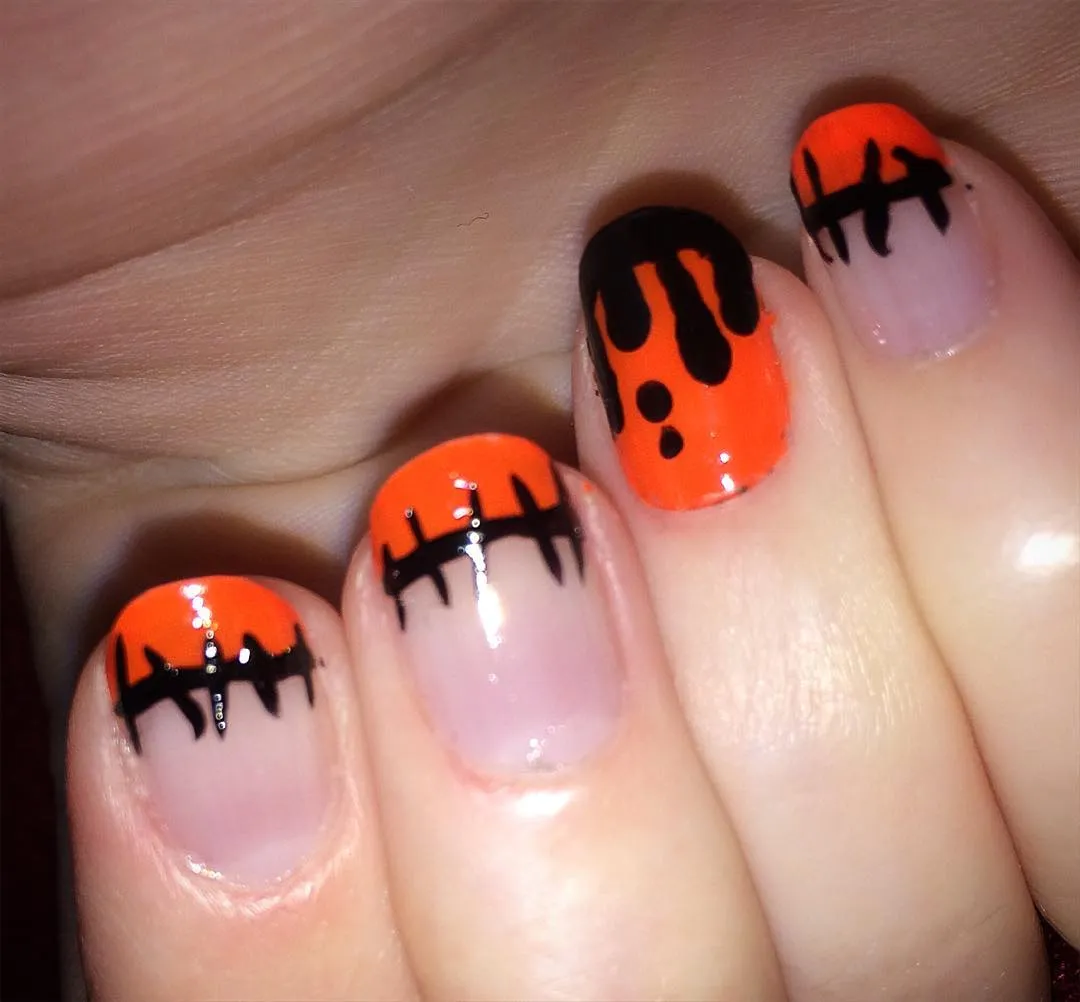Orange tips with black drip accents
