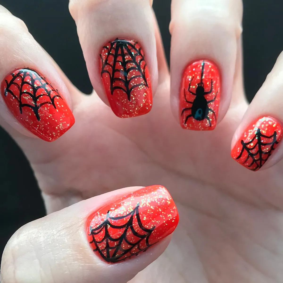 Red glitter spiderweb nails