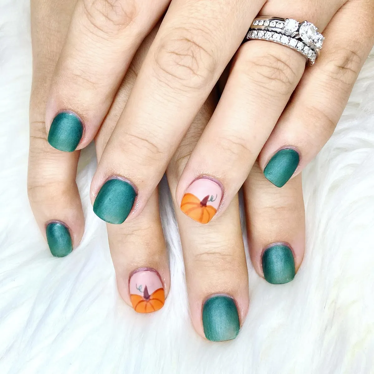Matte teal-green with pumpkin accent nails