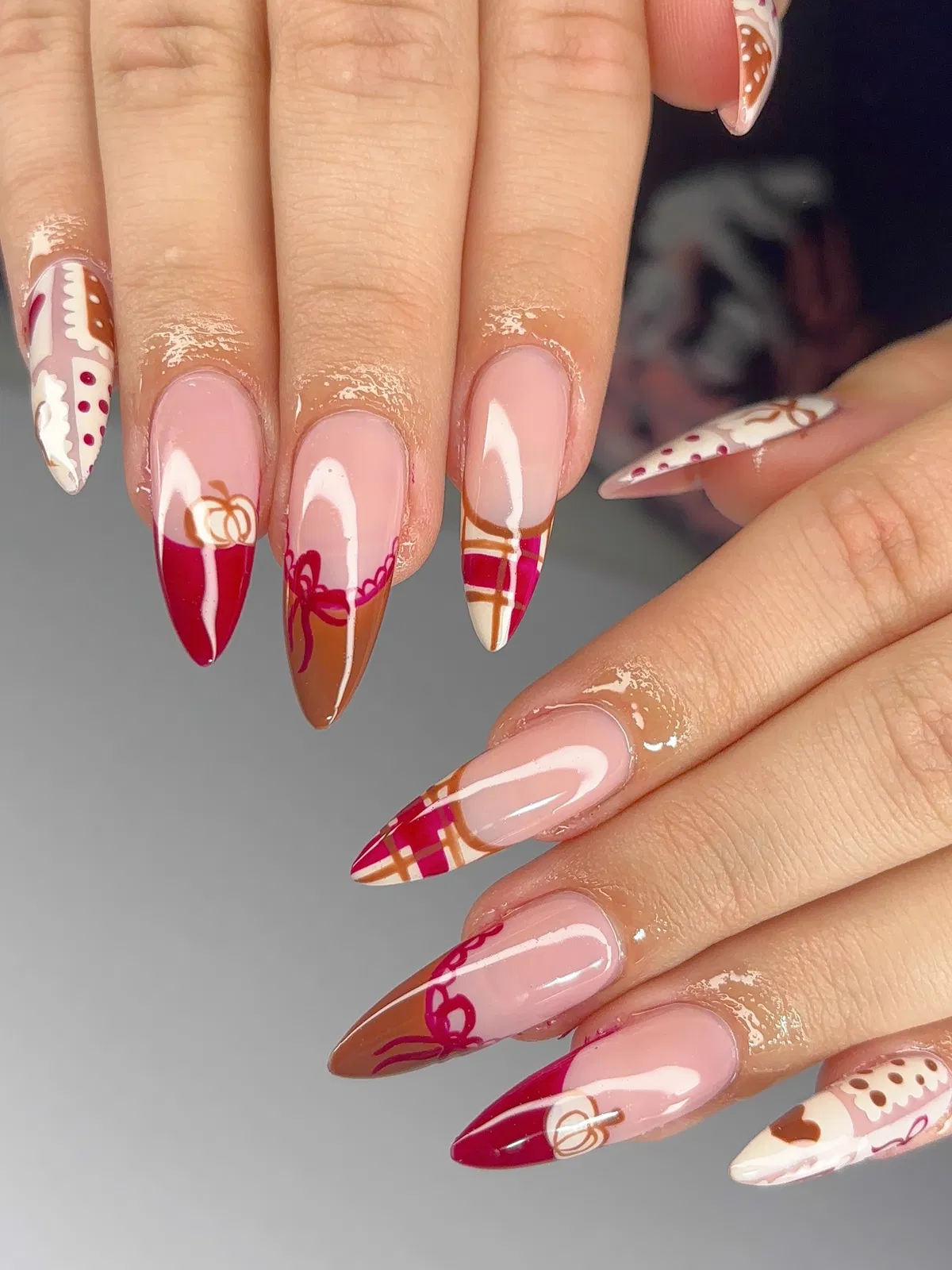 Long nude base with red/brown color-block and plaid details