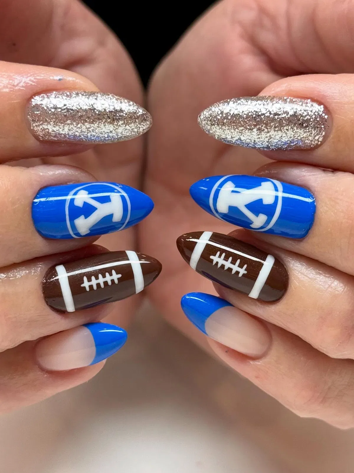 Blue letter accents with football nails and silver glitter