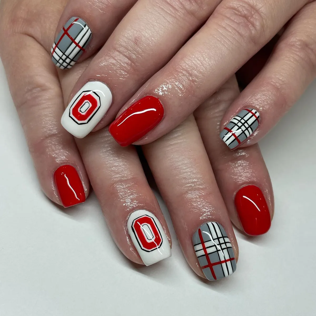 Red, white, and gray plaid with bold 'O' motif