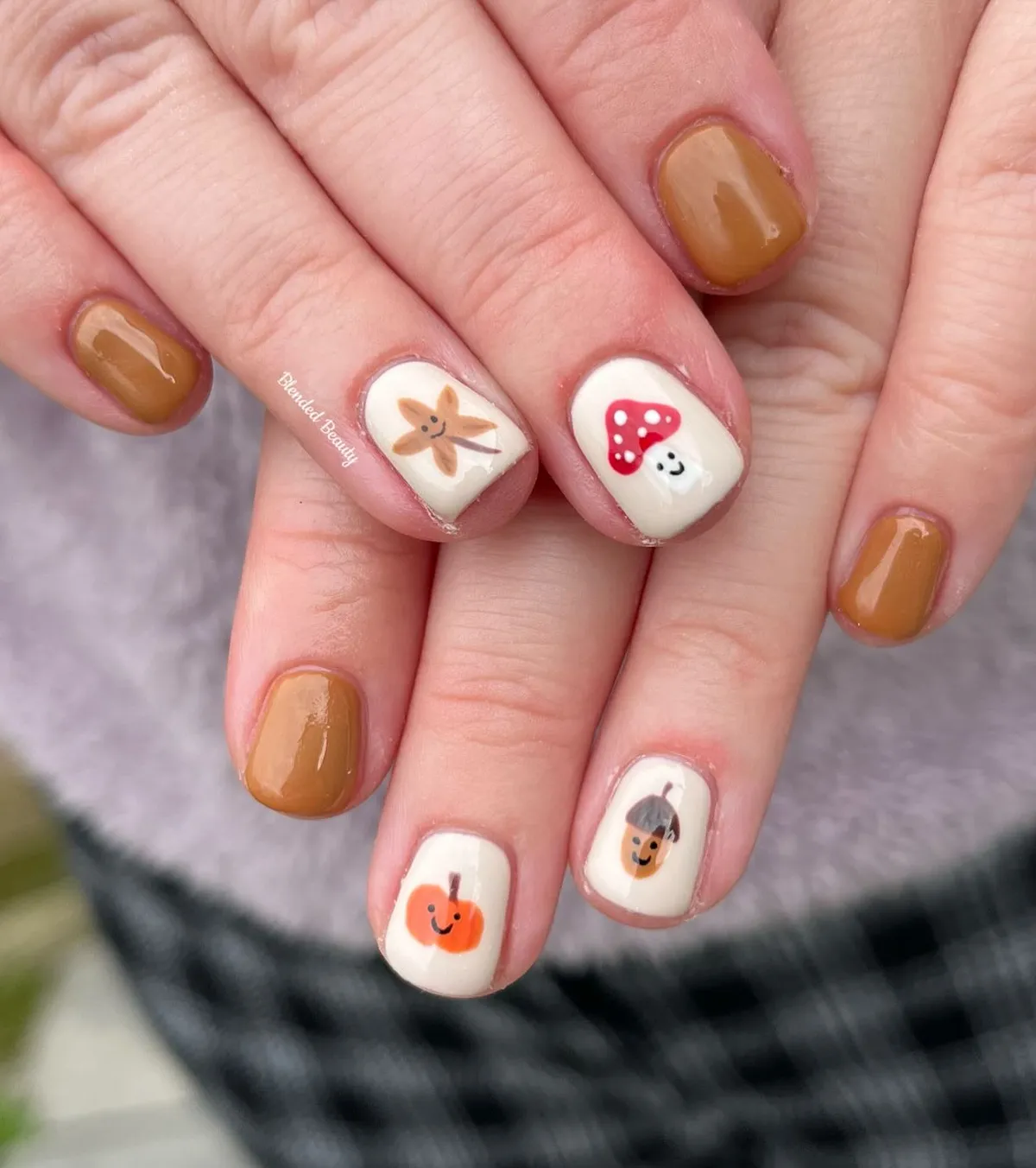 Tan solids with cute icon accent nails