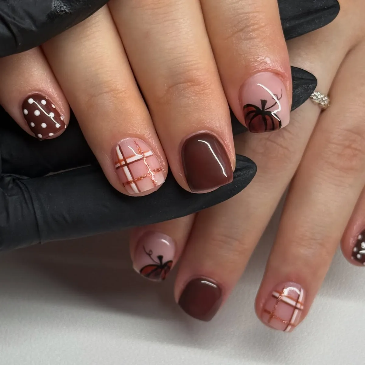 Nude-and-brown mix with plaid, dots, and pumpkin outlines