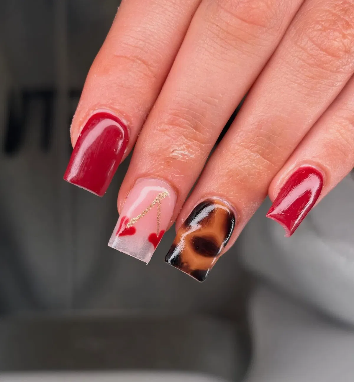 Deep Red with Heart Accent and Brown-Black Marbled Nail