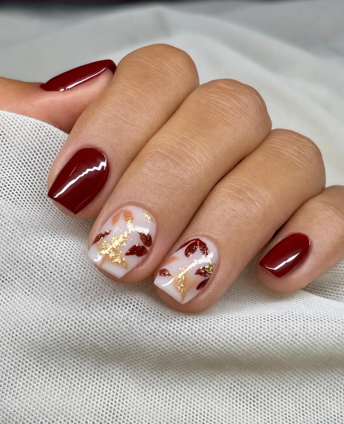 Deep red with milky white leaf-and-gold accents