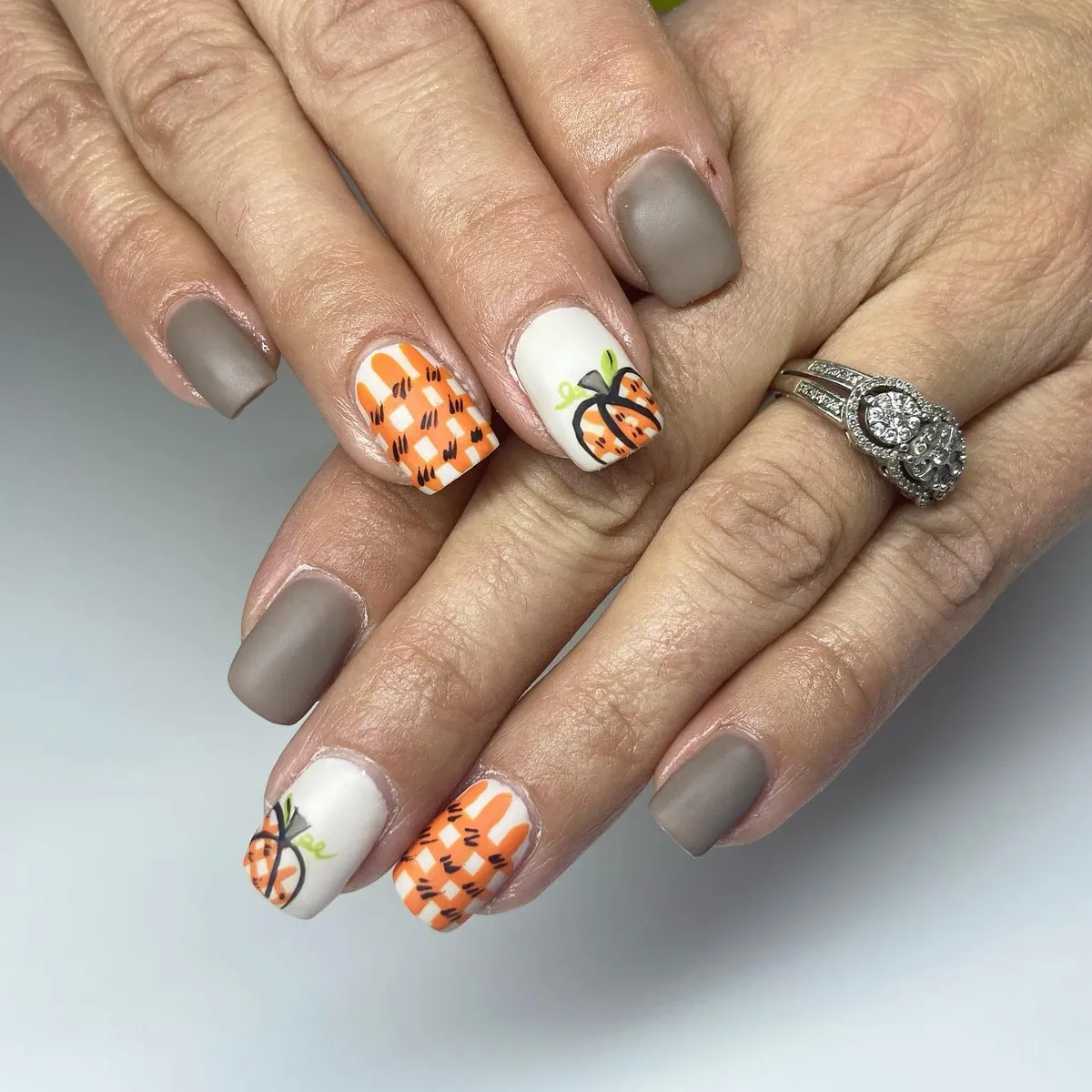 Matte taupe with check accents and bow-tied pumpkin art