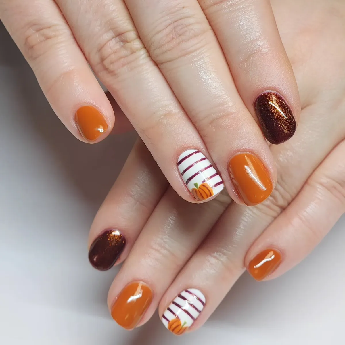 Burnt orange and striped pumpkin accents