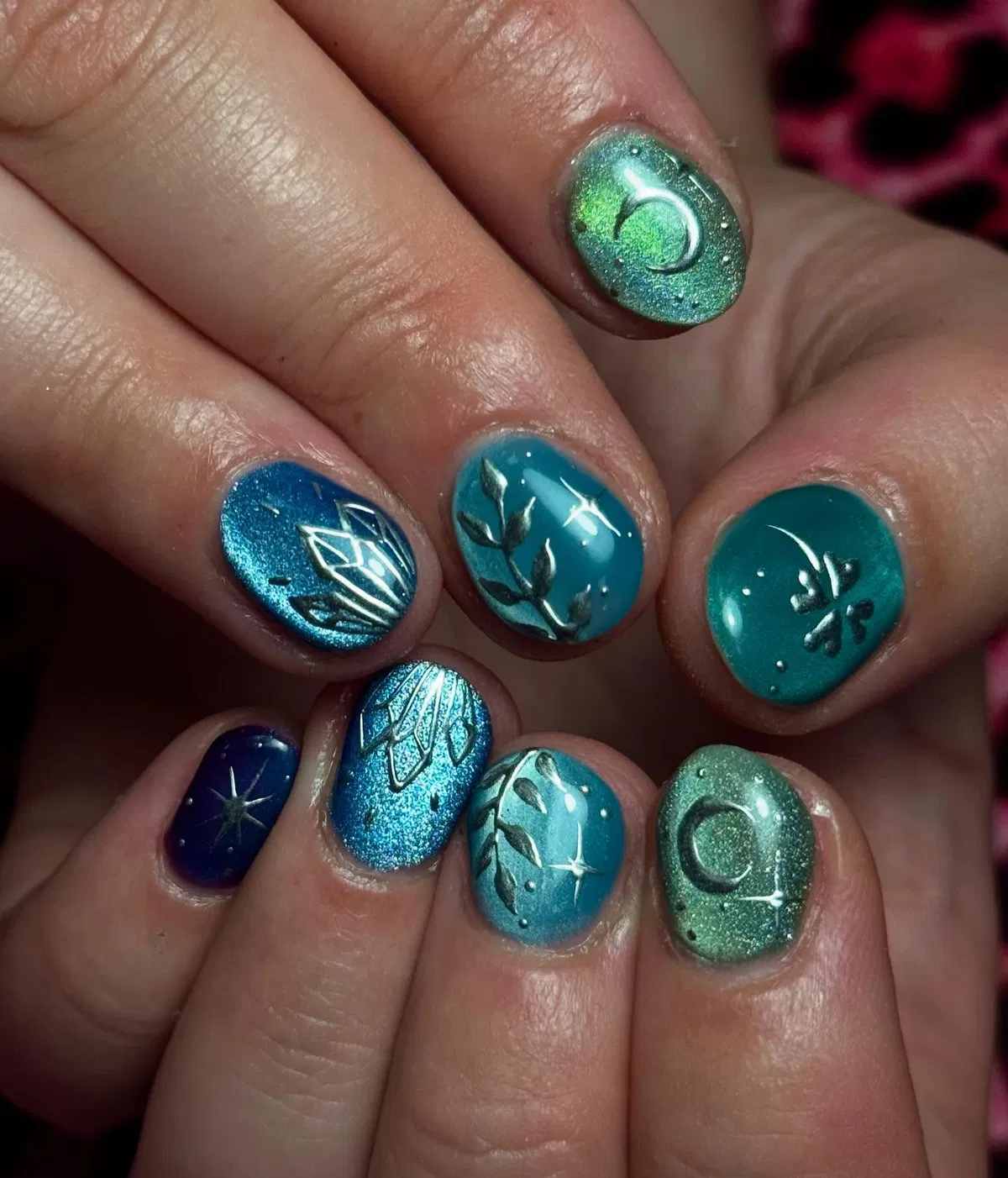 Teal-to-navy metallics with silver raised-style motifs
