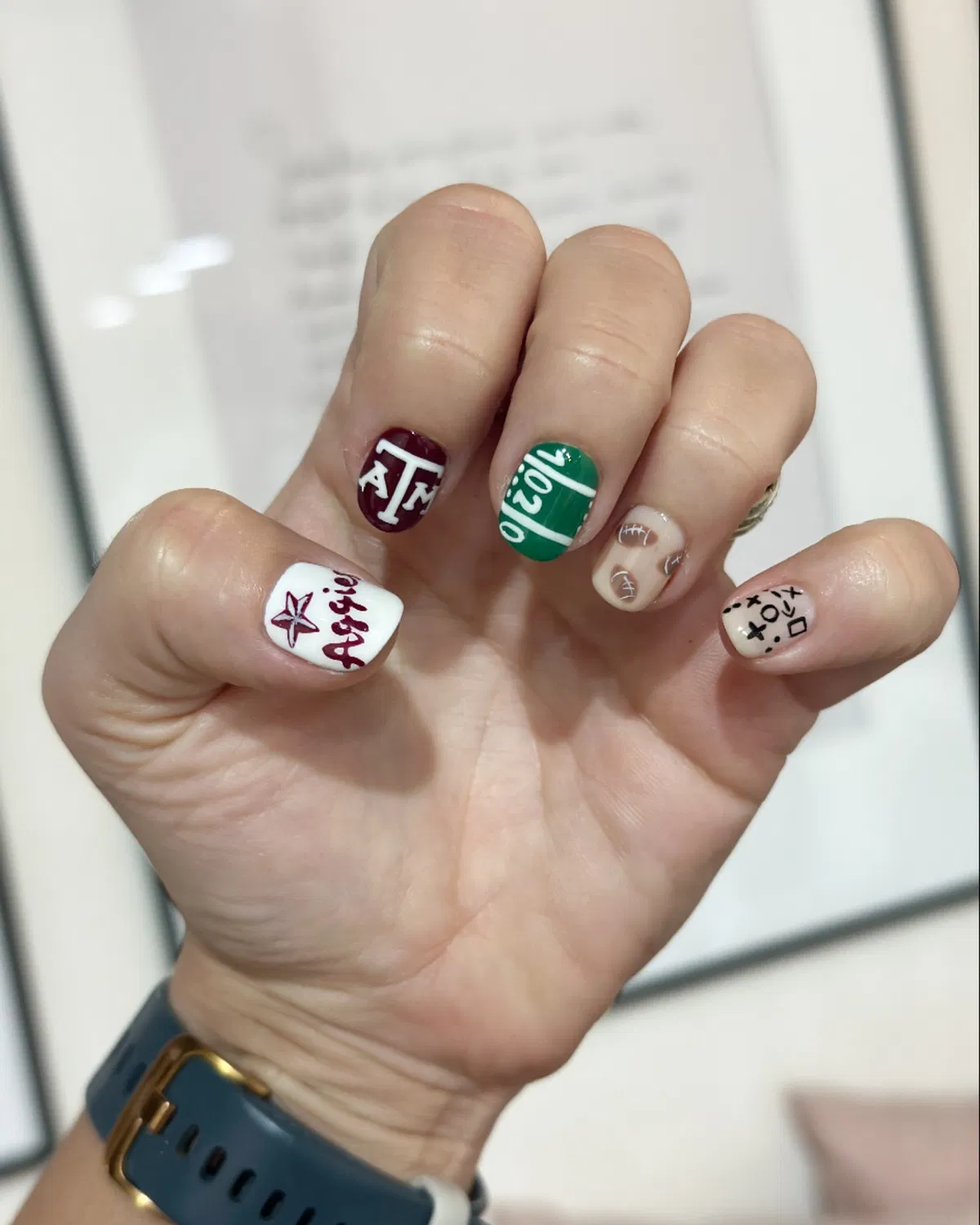 Maroon lettering + green field + play-diagram mix