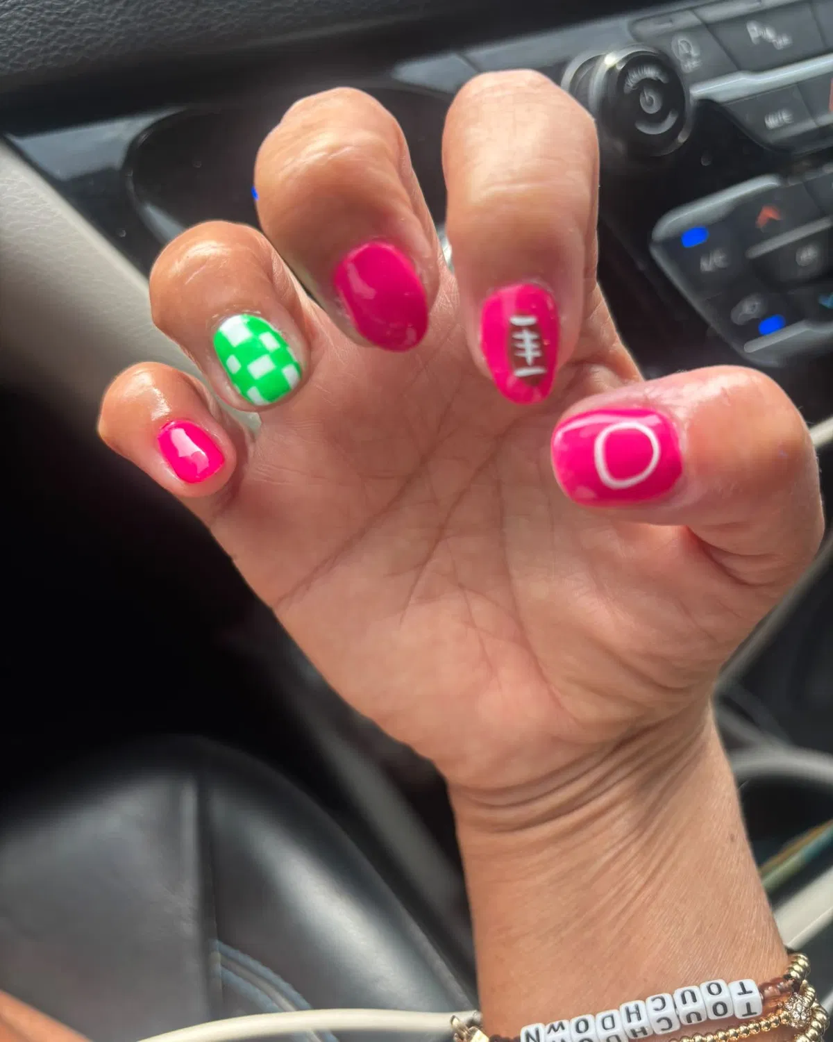 Hot pink set with football icon, green checkerboard, and white 'O'