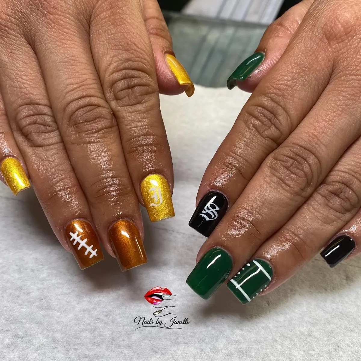 Metallic gold/bronze with football-lace detail and green field lines