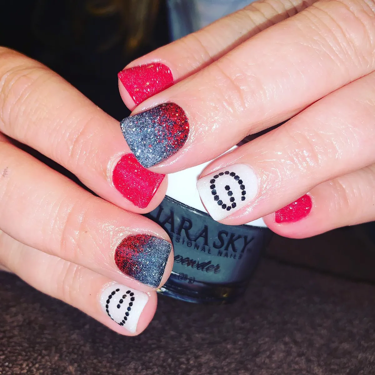 Red glitter and white dotted horseshoe motifs