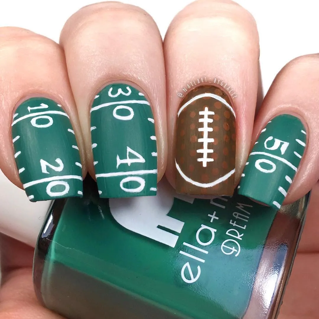 Green field markings with yard-line numbers and football accent