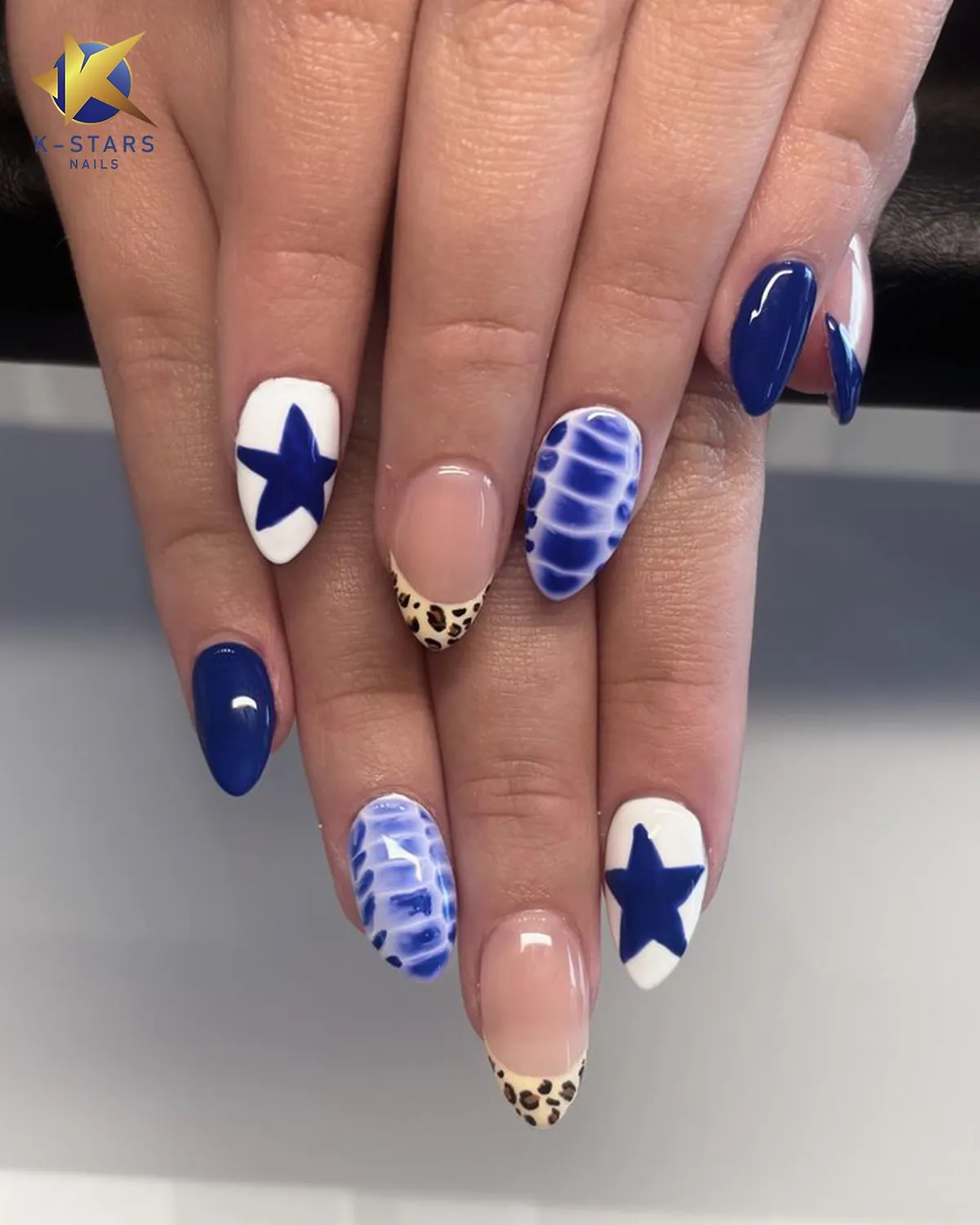 Blue star accents with marbled blue and spotted French tips