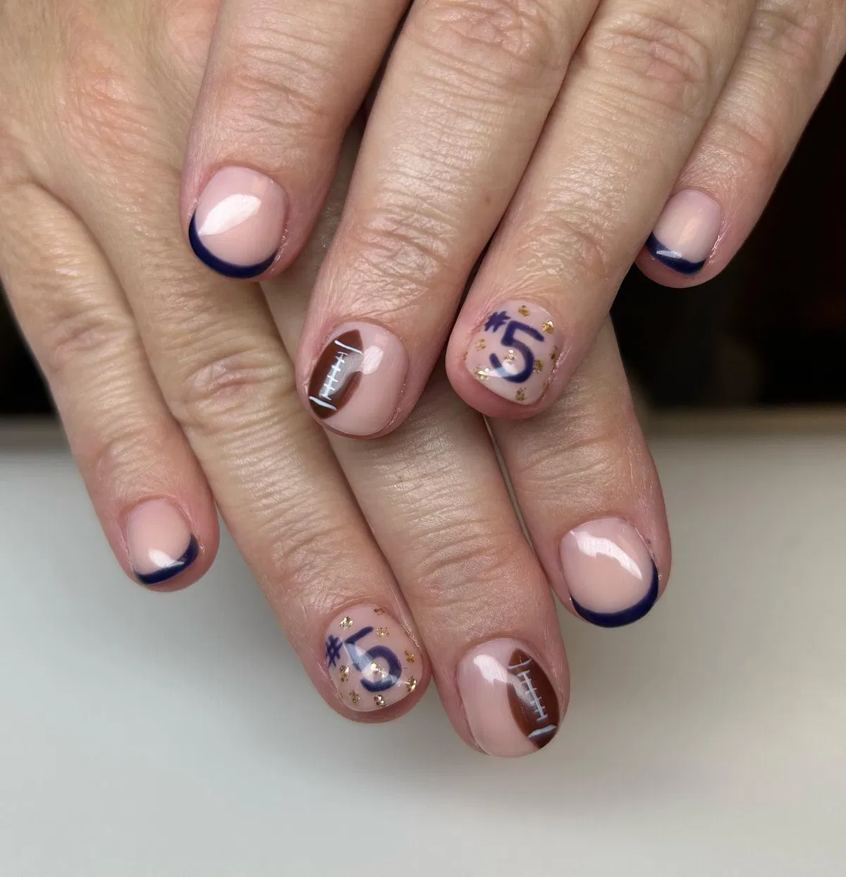 Navy micro-French with “#5” and lace-corner accents