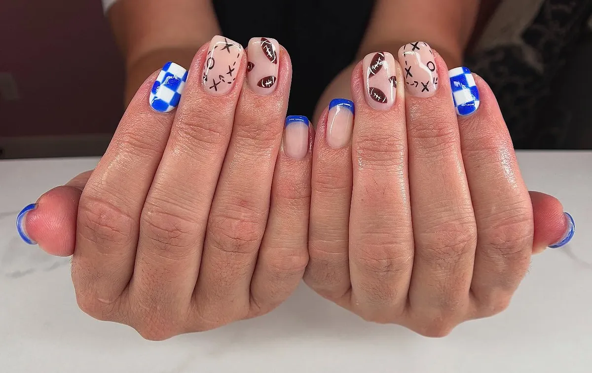 Blue French tips with checkerboard and play-diagram accents