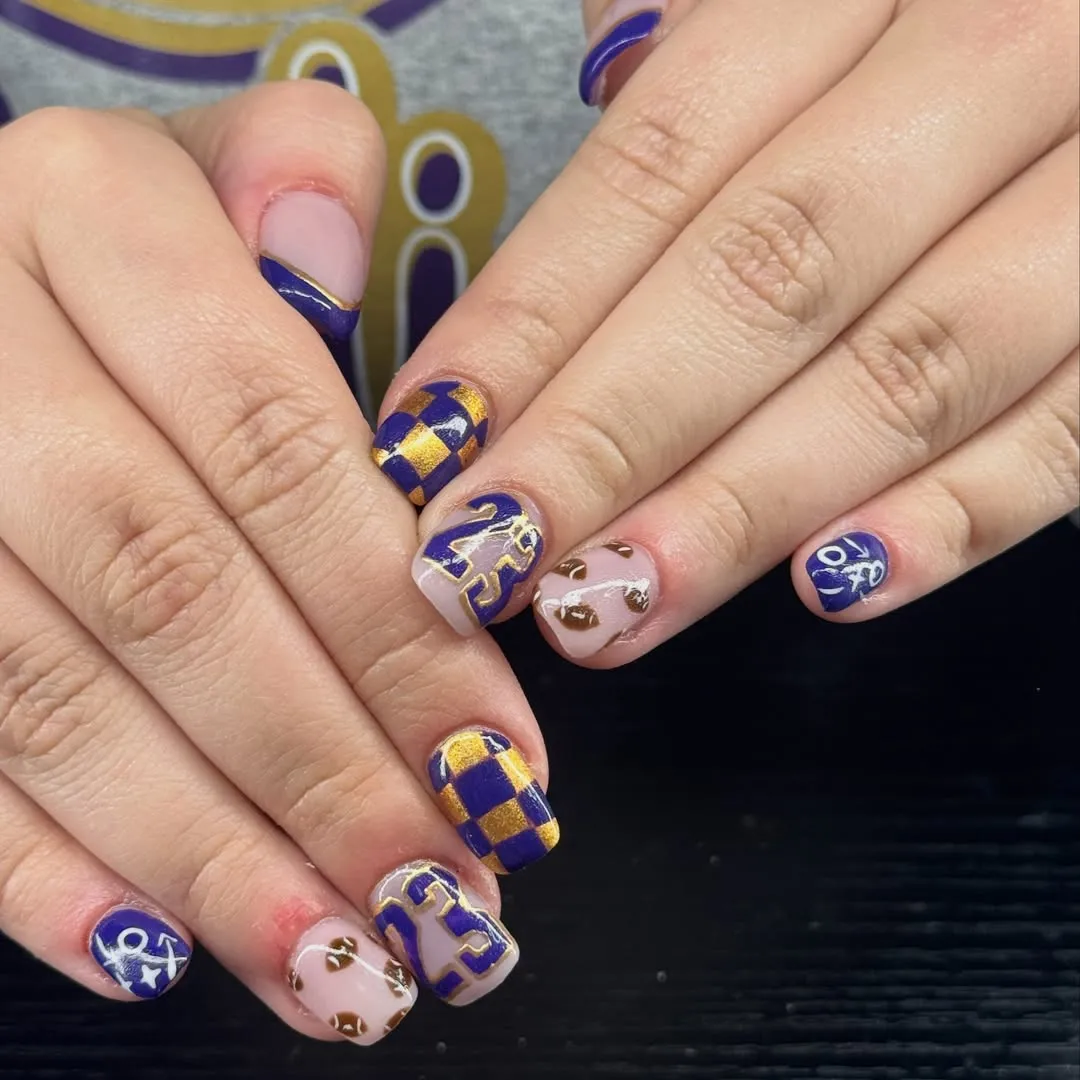 Purple-and-gold checkerboard with “23” and mini footballs
