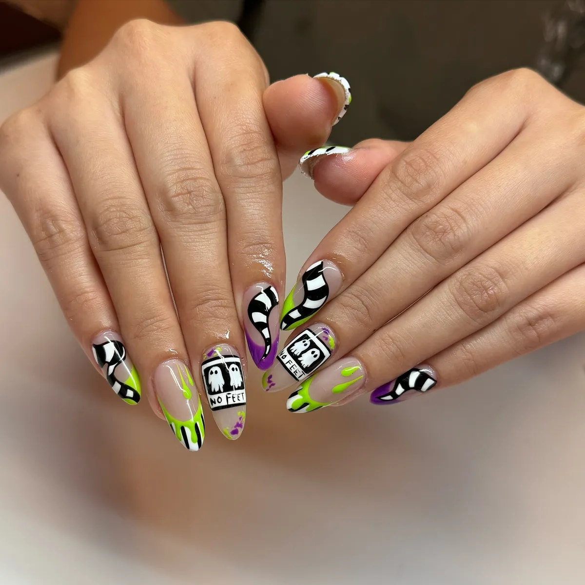 Wavy stripes with neon accents and “NO FEET” ghost panels