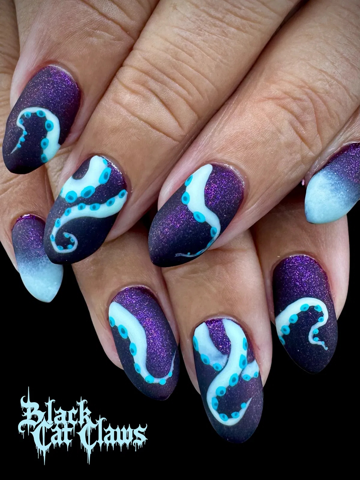 Matte purple with white-and-turquoise tentacle graphics