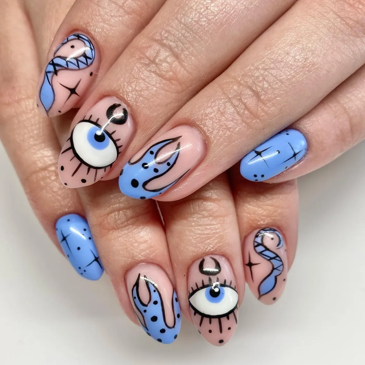 Blue-and-nude graphic eyes and swirls