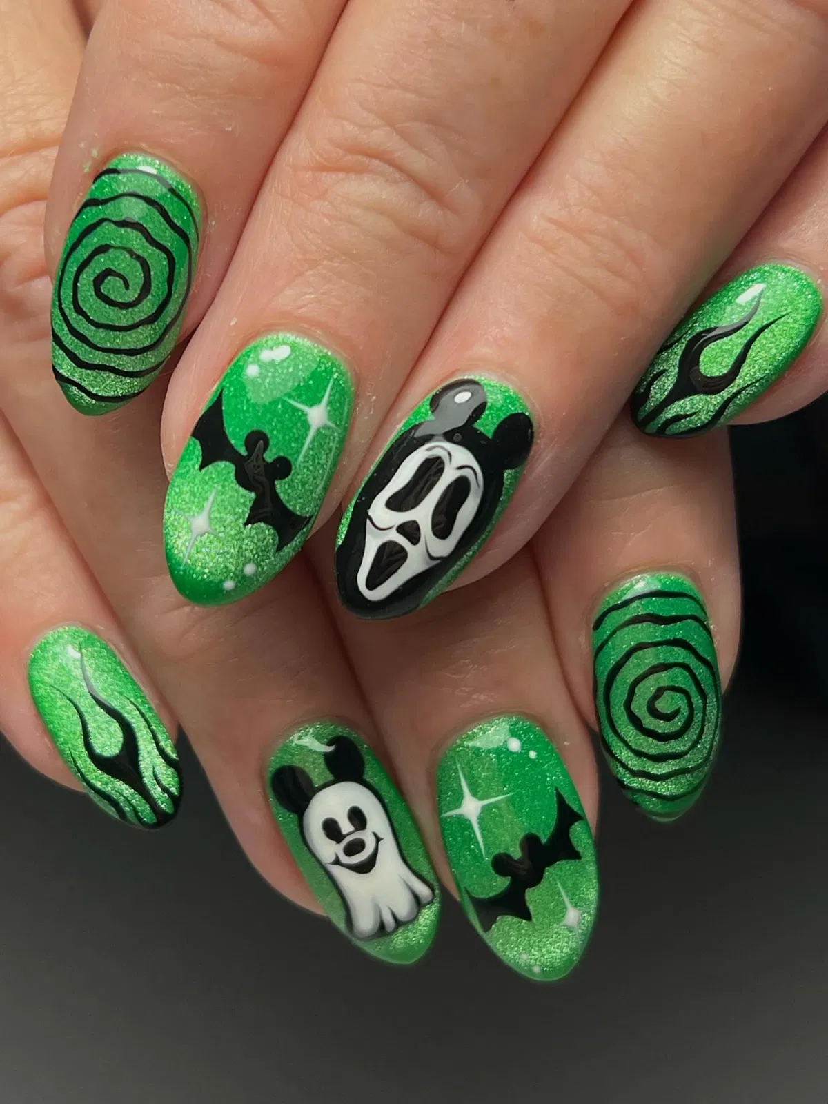 Green glitter with spirals, bats, and a mask face