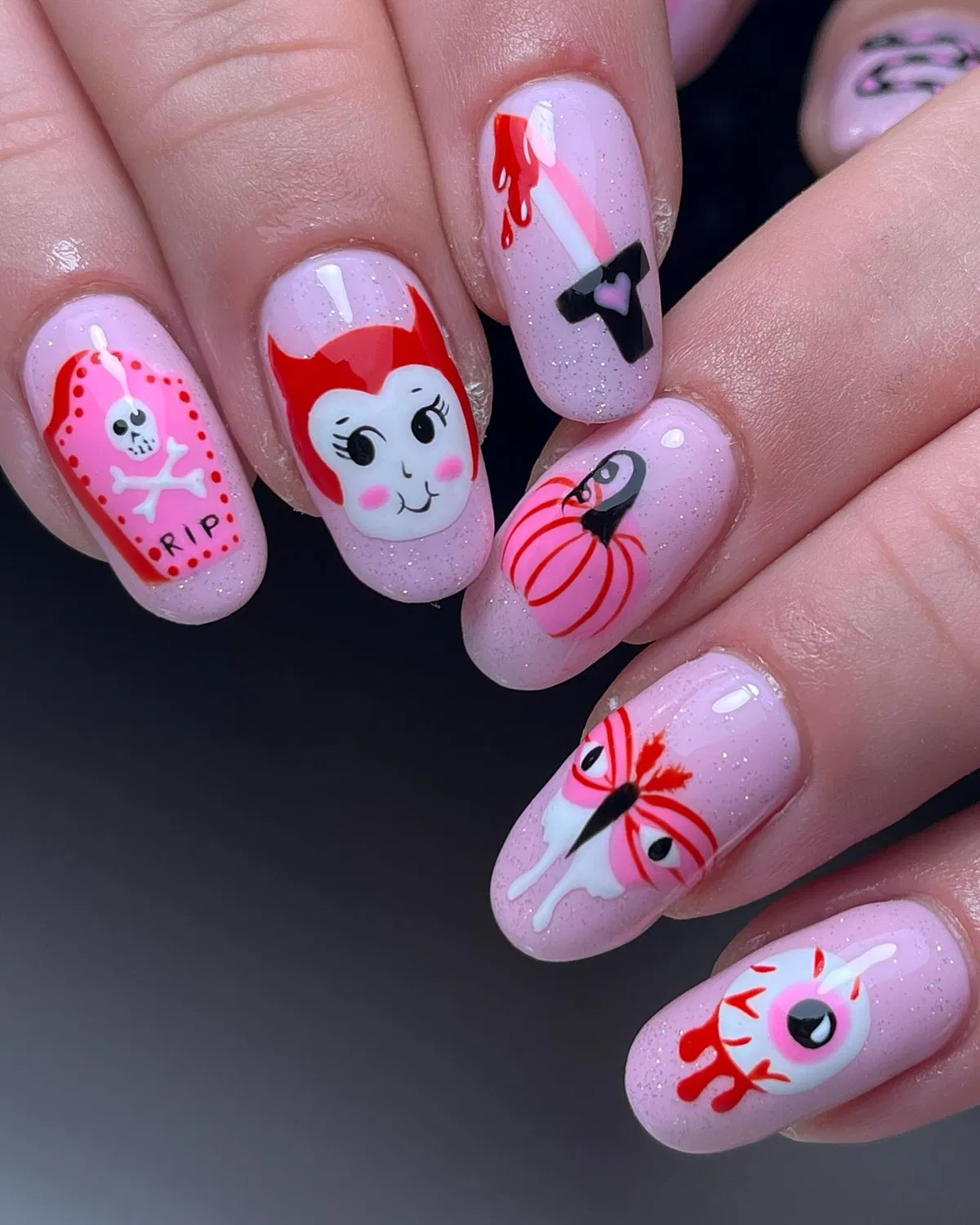 Pink sparkle set with red drips and mixed icons