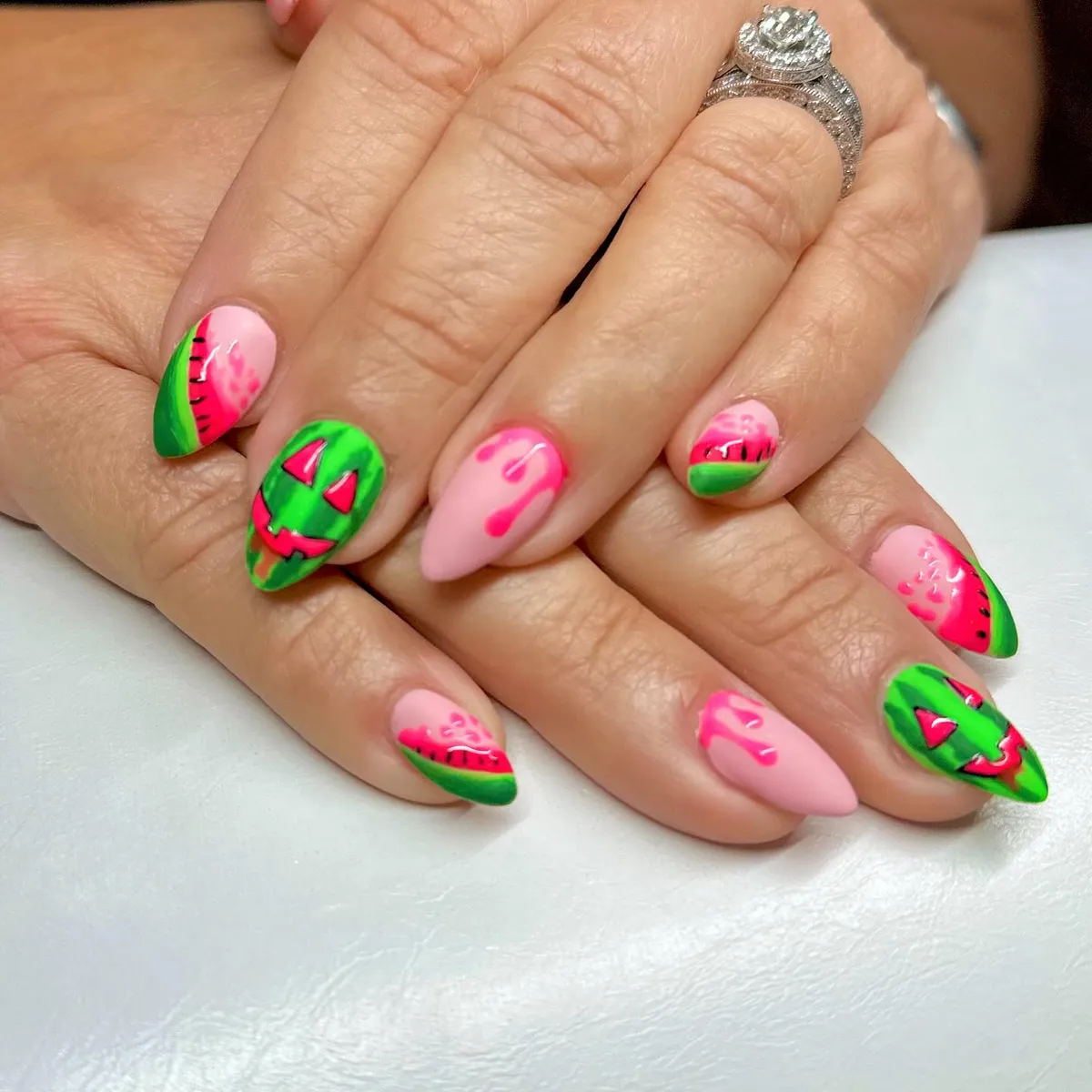 Watermelon-inspired colors with jack-o'-lantern faces and drips
