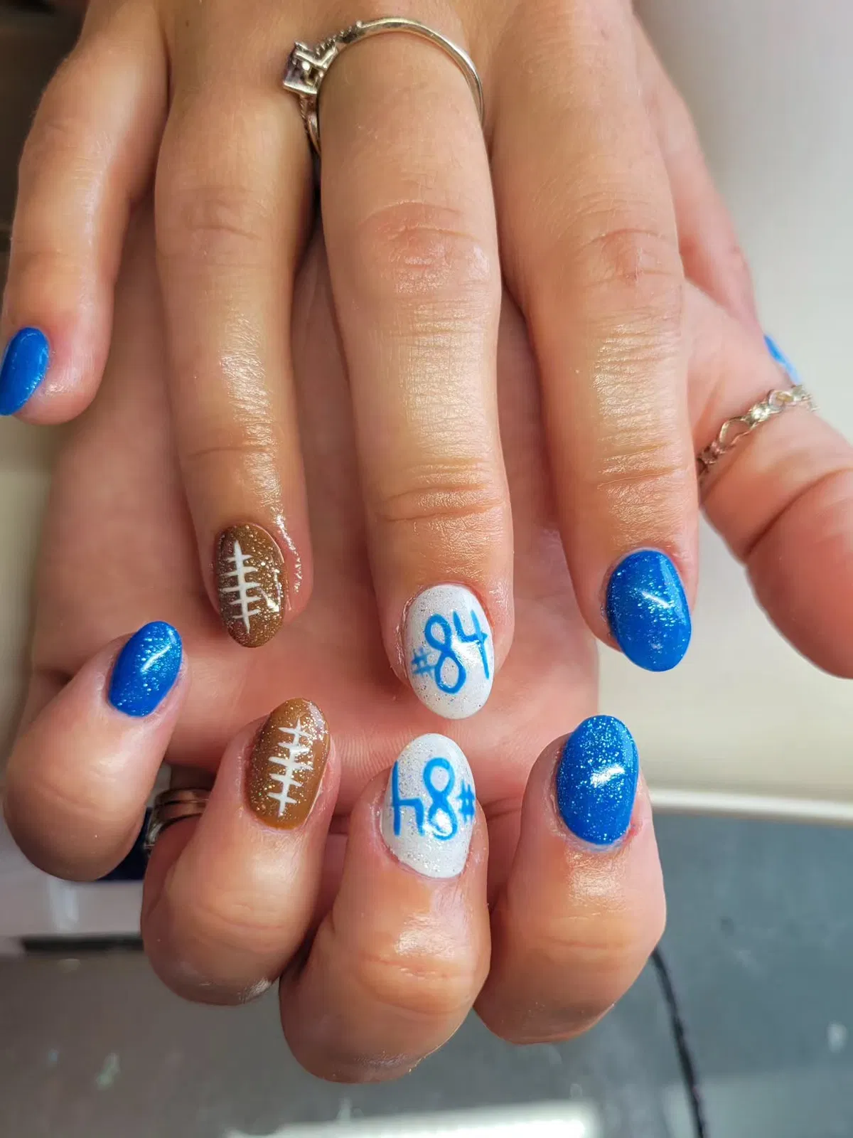 Blue shimmer with football laces and blue jersey numbers