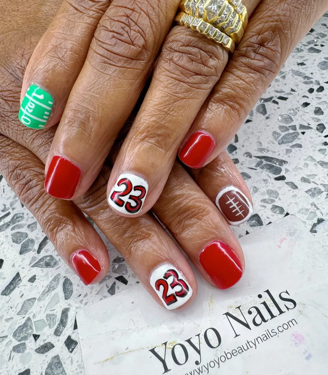 Red and white numbers with green field text and football accent