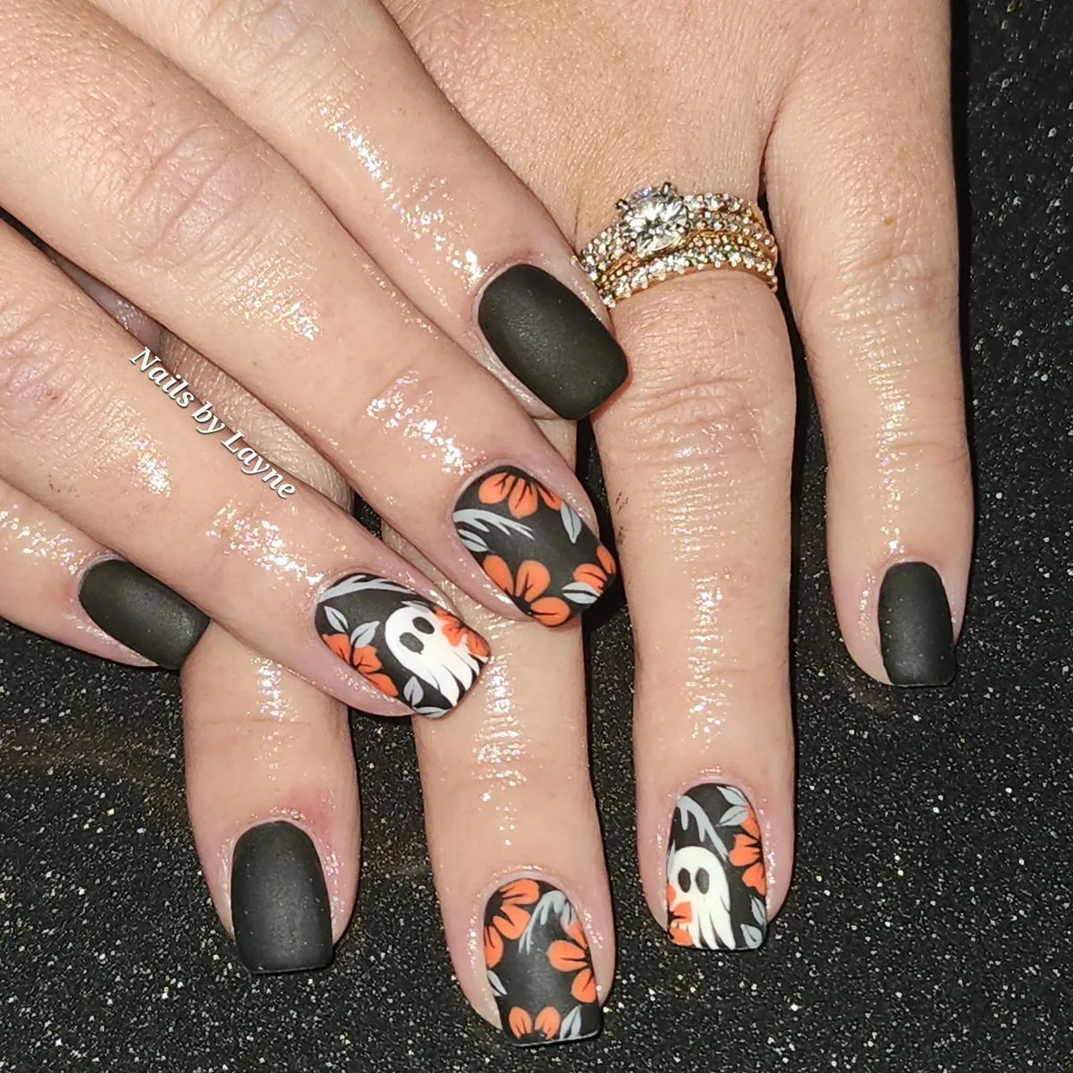 Matte black with orange florals and ghost accents
